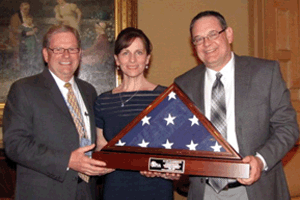 Special AFIA recognition: (left to right) AFIA President Joel Newman with Debi and Al Gunderson